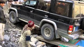 Crossing the Attabad Lake in Hunza Pakistan A TravelPak Trailer [upl. by Asilanna]