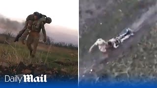 Two hero Ukraine soldiers save their wounded comrades by carrying them across Bakhmut battlefields [upl. by Ettevi]