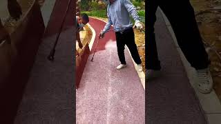 Spraying process of anti slip colored particles on concrete pavement [upl. by Yanal]