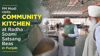 PM Modi visits community kitchen at Radha Soami Satsang Beas in Punjab [upl. by Ailugram]