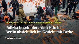 Berliner Polizist beschmiert KlimaAktivistin in Berlin absichtlich im Gesicht mit Farbe [upl. by Trebma]