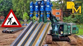 Pile driver pressing massive steel sheet piles into the ground Sennebogen ABI TM18 [upl. by Malas]