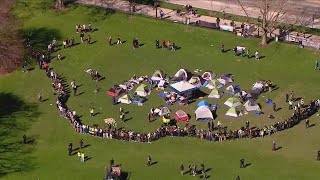 Northwestern students set up camps protesting war on Gaza police present [upl. by Lenor]