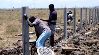 Erecting a concrete fencing posts [upl. by Anavrin]