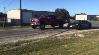 2014 Silverado supercharged 53 vs stock Z28 camaro [upl. by Seuqramed]