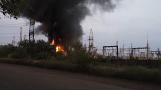 Ukrainian emergency workers extinguish flames of burning electrical substation hit by Russian bombin [upl. by Ymereg66]