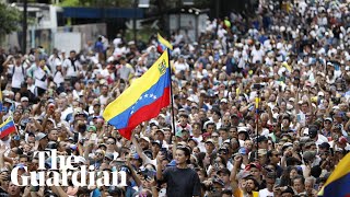 Thousands rally in Venezuela as Maduro threatens to detain defiant leaders of opposition [upl. by Eelarol]