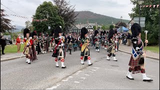 Massed Pipe Bands marching through Braemar to the 2022 Braemar gathering in Royal Deeside Scotland [upl. by Jimmy]