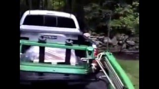 Using Artillian Pallet Forks to unload a skid from a pickup bed with a John Deere 2305 [upl. by Stempien282]