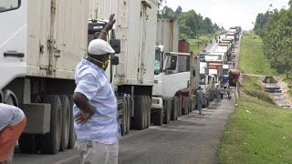 Traffic jams at KenyaUganda border as truck drivers undergo health checks  AFP [upl. by Iives184]