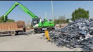 Sennebogen 821 Unloading Truck with Magnet [upl. by Zedecrem]