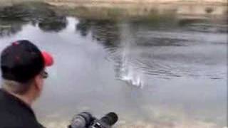 M134A1 Vulcan Airsoft Minigun Firing Airsoft BBs into Pond [upl. by Tanah295]