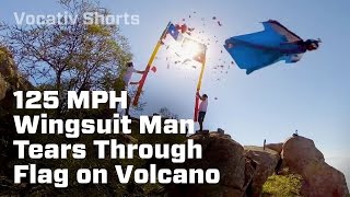 Wingsuite Man Tears Through Flag on Volcano [upl. by Calabresi]