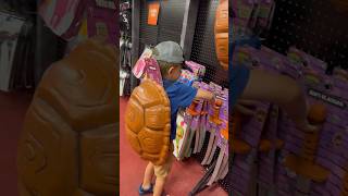 Kids trying on teenage mutant ninja turtles costume at Spirit Halloween [upl. by Placidia]