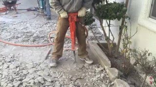 Jack Hammering Concrete With High Powered Air Jack Hammer [upl. by Dennis828]