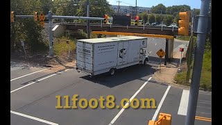 Moving truck hits 11foot88 bridge and leaves presents for bystanders [upl. by Afinom]