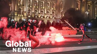 Tensions high after thousands of protesters storm Serbian parliament over planned lockdown [upl. by Akinert]