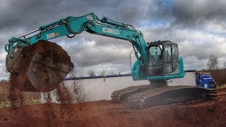 Kobelco and Hitachi Excavators Loading Trucks [upl. by Airetnuhs]