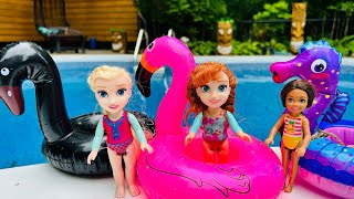 BARBIE  ELSA and ANNA toddlers POOL FUN   floaties race  fun challenge  water slide  splash [upl. by Dej]