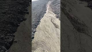 More spring runoff digging through the clay cliffs A quick stream slows down Dumps sediment [upl. by Clim642]