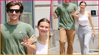 Millie Bobby Brown rocks a white crop top and gray pants while packing on the PDA with husband Jake [upl. by Yemaj]