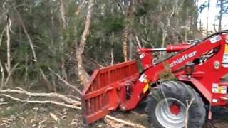 Front end loader Schaffer 5050Z being used as a bulldozer with stick rake in Australia [upl. by Tompkins280]