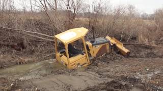 Dozer Recovery CAT Excavator pulls Deere Dozer Out [upl. by Erdnassac]