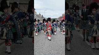 drummajors lead marchingband pipebands into Tomintoul for 2024 highlandgames in Scotland shorts [upl. by Bardo]