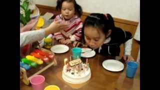 Funny girl blowing candle on sisters birthday cake [upl. by Akemet]