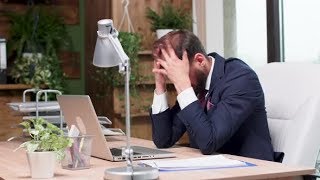 Exhausted Office Worker Sitting at His Desk  Stock Footage  Videohive [upl. by Nanete]