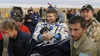 Recordbreaking Russian cosmonaut returns to Earth [upl. by Lonnard]