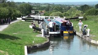 Caen Hill Locks on the Kennet and Avon Canal near Devizes [upl. by Mcneely353]