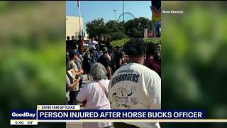 Dallas Police bucked off horse at State Fair  lands on someone [upl. by Moureaux]