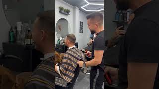 Barber battles bark dog disrupts shave session in Bucharest [upl. by Eserehc317]