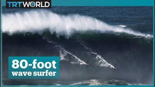 Surfer takes on monster wave in Portugal [upl. by Hayila974]