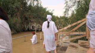 Women Get Into the Water Ritual of Baptism Jordan River Israel Small Swampy River Clayish Bottom [upl. by Lopez]