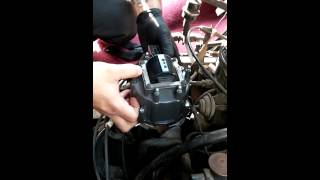 How to replace a distributor cap and rotor [upl. by Puduns]