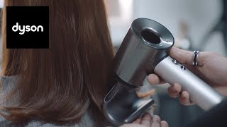 Using the attachments on the Dyson Supersonic™ professional hair dryer [upl. by Aerdnat711]