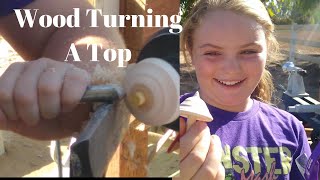 Expert Teaches 10yearold How to use a Wood Lathe She Makes a Top using a wood lathe [upl. by Ellesij]