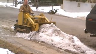 Mini BullDozer Magna Trac Junior moving ice amp snow [upl. by Ardnoel]