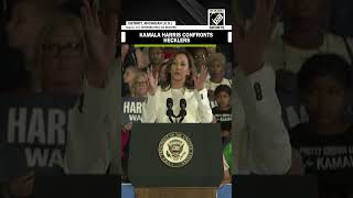 Harris lambasts Trump faces down heckler at Michigan rally [upl. by Viking]