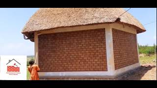 Applying paint on the plastered parts Queen Elizabeth Safari Lodges KaseseUganda [upl. by Kotick]