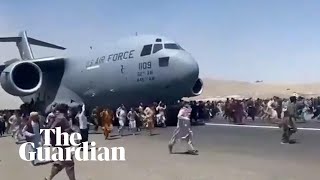 Afghans climb on to plane during takeoff in attempt to flee Taliban [upl. by Oakes784]