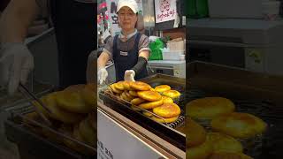 Hotteok pancakes at the Korean food market travel hotteok seoul koreanfood [upl. by Yenor]