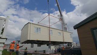 Chesil beach holiday park crane lifting caravans into place [upl. by Nelly]