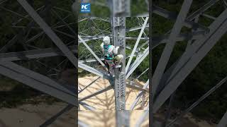 Technician climbing transmission tower for inspection in Chinas Shanxi [upl. by Eyaf738]