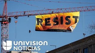 “Resist” el mensaje que Greenpeace puso en una grúa de 270 pies de altura cerca de la Casa Blanca [upl. by Emiolhs]