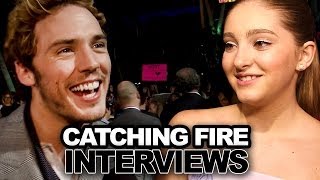 Sam Claflin Bella Thorne Talk Jennifer Lawrence Details on Gloss Catching Fire Kill Scene [upl. by Ylak]