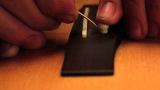 How to restring an acoustic guitar with DAddario strings [upl. by Darell]