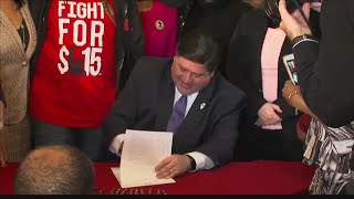 Illinois Governor signs bill that would raise minimum wage to 15hr by 2025 [upl. by Amilas241]